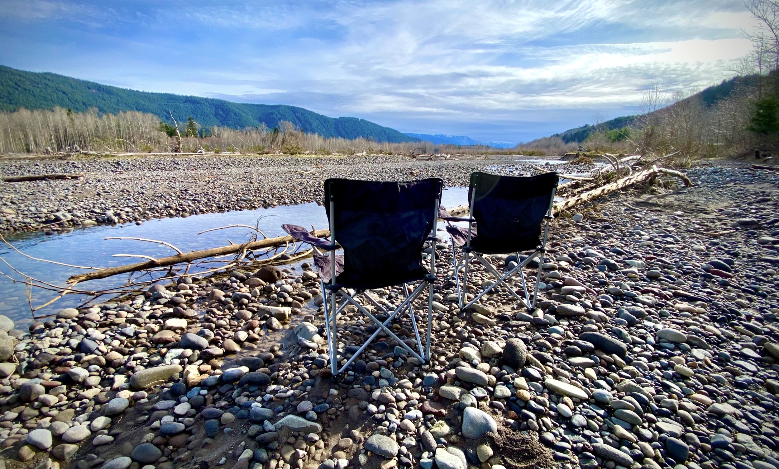 Chairs on the shore of the Nisqually River near Mt. Rainier vacation rental