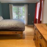 King bed, dresser, sliding door to deck at ashford elbe mineral rental cabin